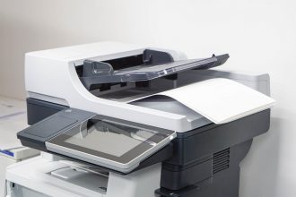 Close Up Paper Sheets On The Printer In Office